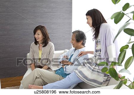 Stock Photograph - Family watching television. Fotosearch
