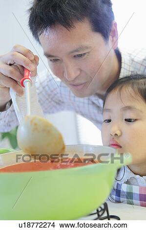 Father and Daughter Cooking Sauce View Large Photo Image Picture - Father and Daughter Cooking Sauce. Fotosearch