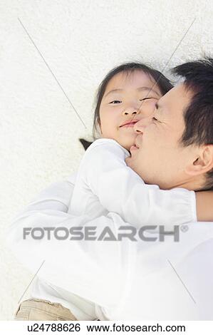 Stock Photograph - Father and Daughter Hugging. Fotosearch