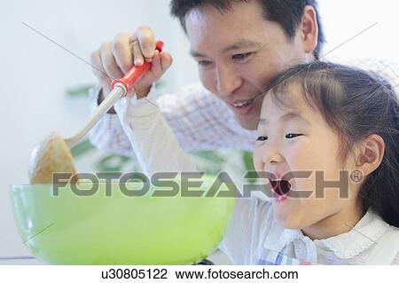 Father and Daughter Preparing Food View Large Photo Image Stock Image - Father and Daughter Preparing Food. Fotosearch