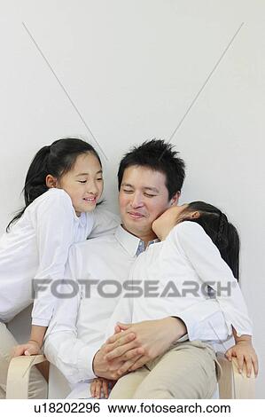 Father with Two Daughters, One Daughter Kissing Him on Cheek View Large Photo Image Stock Photograph - Father with Two Daughters, One Daughter Kissing Him on Cheek. Fotosearch