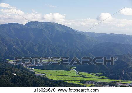 Stock Image - Fields Betwee Mount Ibuki Peaks. Fotosearch
