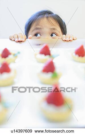 Stock Photo - Girl and Cakes. Fotosearch