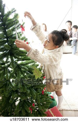 Girl Decorating Christmas Tree View Large Photo Image Stock Image - Girl Decorating Christmas Tree. Fotosearch