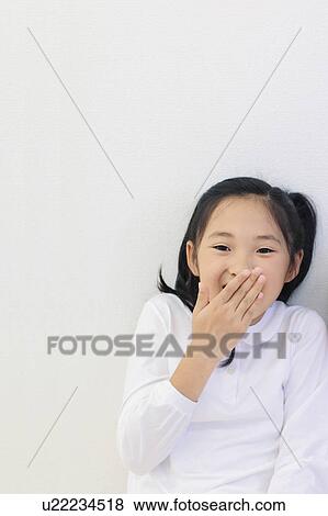 Girl Laughing With Hand Over Mouth View Large Photo Image Stock Photo - Girl Laughing With Hand Over Mouth. Fotosearch