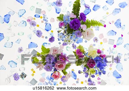 Stock Image - Glass Pieces and Flowers. Fotosearch