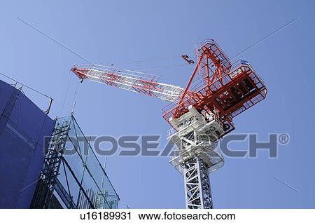 Stock Image - Industrial Crane Against Blue Sky. Fotosearch