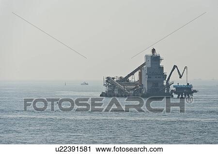 Stock Image - Industrial Vessel at Sea. Fotosearch