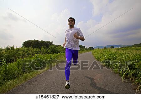Stock Photo - Man jogging, Kyoto Prefecture, Honshu, Japan. Fotosearch