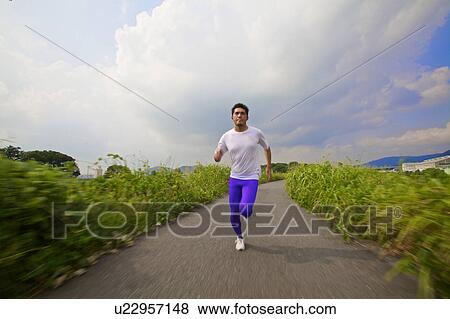 Stock Photo - Man jogging, Kyoto Prefecture, Honshu, Japan. Fotosearch