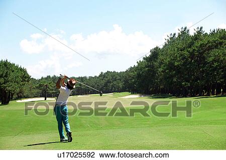 Stock Image - Man playing golf, Miyazaki Prefecture, Kyushu, Japan. Fotosearch