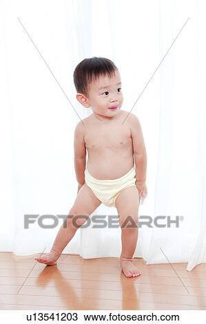 Mischievous Looking Baby Boy View Large Photo Image Stock Image - Mischievous Looking Baby Boy. Fotosearch