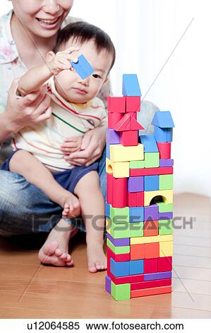 Mother and Baby Boy Playing With Toy Blocks View Large Photo Image Stock Photography - Mother and Baby Boy Playing With Toy Blocks. Fotosearch