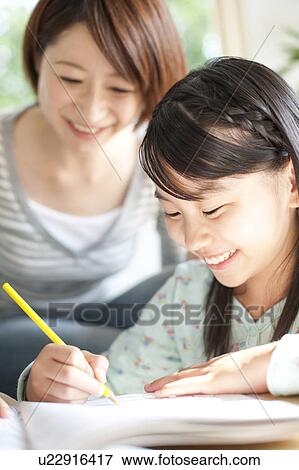 Stock Photo - Mother and daughter drawing. Fotosearch