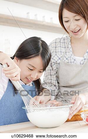Mother and daughter in kitchen baking, Hyogo Prefecture, Honshu, Japan View Large Photo Image Stock Photo - Mother and daughter in kitchen baking, Hyogo Prefecture, Honshu, Japan. Fotosearch