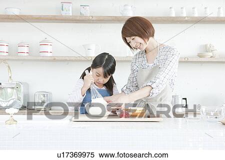Mother and daughter in kitchen baking, Hyogo Prefecture, Honshu, Japan View Large Photo Image Stock Photography - Mother and daughter in kitchen baking, Hyogo Prefecture, Honshu, Japan. Fotosearch