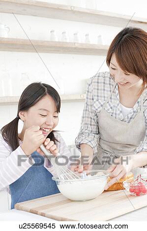 Mother and daughter in kitchen baking, Hyogo Prefecture, Honshu, Japan View Large Photo Image Stock Photography - Mother and daughter in kitchen baking, Hyogo Prefecture, Honshu, Japan. Fotosearch