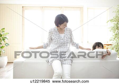 Mother and son in the living room View Large Photo Image Stock Photography - Mother and son in the living room. Fotosearch