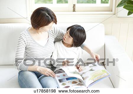 Mother And Son Reading A Book Stock Photo U17858198 Fotosearch