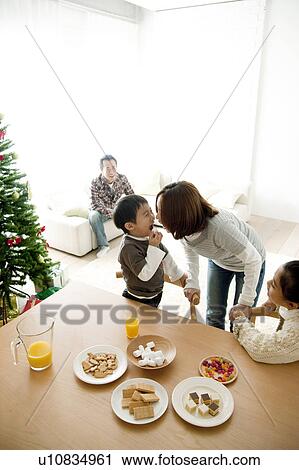 Mother, Daughter and Son at Dining Table at Christmas View Large Photo Image Stock Image - Mother, Daughter and Son at Dining Table at Christmas. Fotosearch