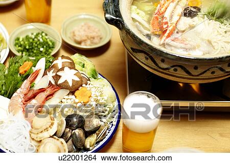 Picture - Nabe and glass of beer, Tokyo Prefecture, Japan. Fotosearch