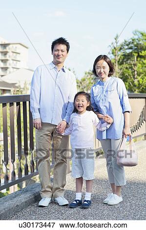Stock Photo - Parents with Daughter. Fotosearch
