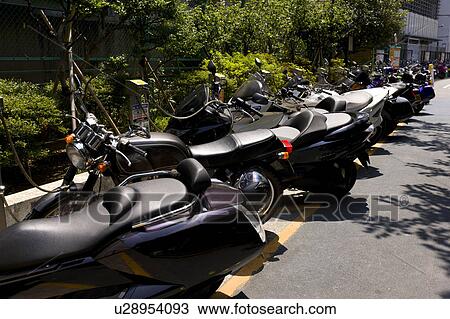 Parked Motorbikes View Large Photo Image Stock Image - Parked Motorbikes. Fotosearch