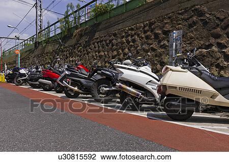 Stock Image - Parked Motorbikes. Fotosearch
