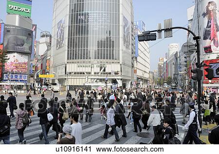 Stock Image - Pedestrians Outside Shibuya Station. Fotosearch