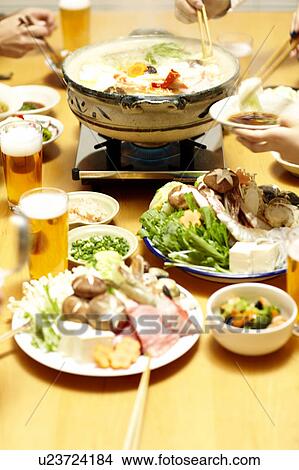 Picture - People eating Nabe, Tokyo Prefecture, Japan. Fotosearch