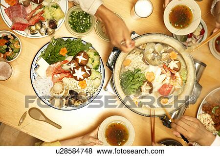 Stock Photo - People eating Nabe, Tokyo Prefecture, Japan. Fotosearch