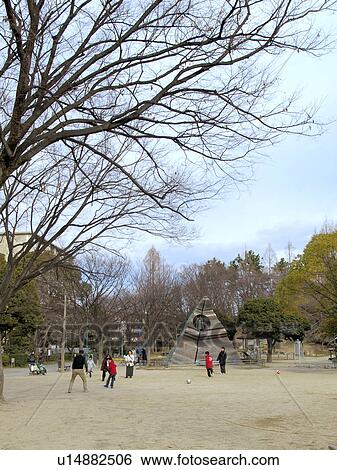 Stock Photograph - People Playing in Park. Fotosearch