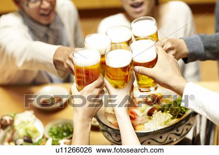 Stock Photograph - People toasting, Tokyo Prefecture, Japan. Fotosearch