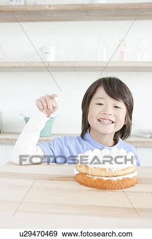 Portrait of a boy with an icing on his finger, Hyogo Prefecture, Honshu, Japan View Large Photo Image Stock Photo - Portrait of a boy with an icing on his finger, Hyogo Prefecture, Honshu, Japan. Fotosearch
