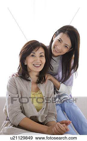 Portrait of mother and daughter View Large Photo Image Stock Photo - Portrait of mother and daughter. Fotosearch