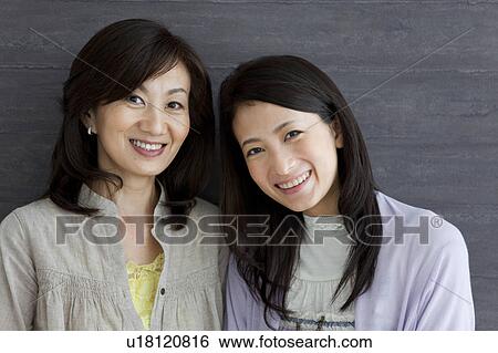 Portrait of mother and daughter View Large Photo Image Stock Photograph - Portrait of mother and daughter. Fotosearch