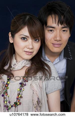Stock Photo - Portrait of young couple. Fotosearch