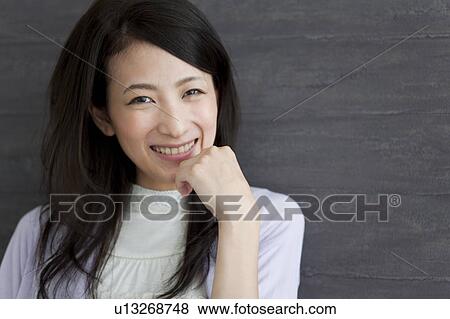 Portrait of young woman View Large Photo Image Stock Photo - Portrait of young woman . Fotosearch