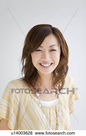 Stock Photo - Portrait of young woman. Fotosearch