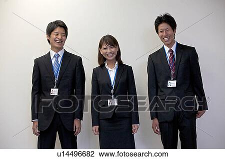 Stock Image - Portrait shots of three business people. Fotosearch
