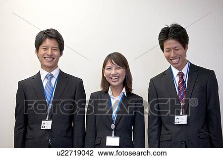 Stock Image - Portrait shots of three business people. Fotosearch