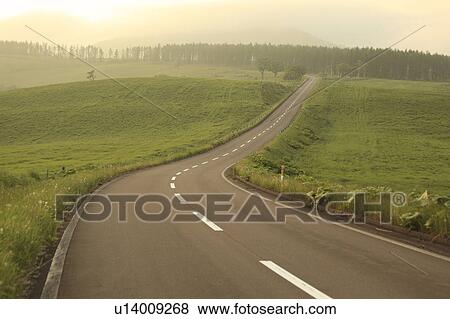 Stock Photo - Road at dusk, Hokkaido Prefecture, Japan. Fotosearch