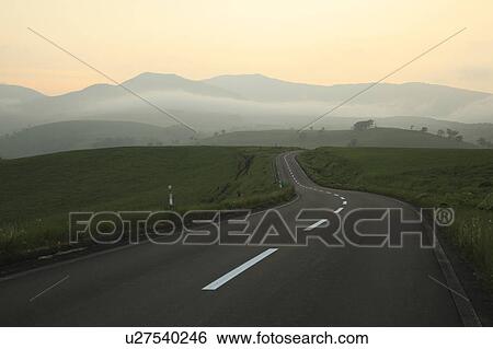 Stock Photograph - Road at dusk, Hokkaido Prefecture, Japan. Fotosearch