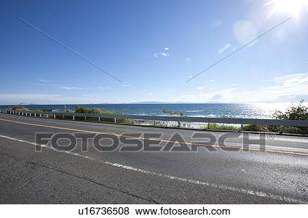 Stock Photo - Road by sea, Aichi Prefecture, Japan. Fotosearch