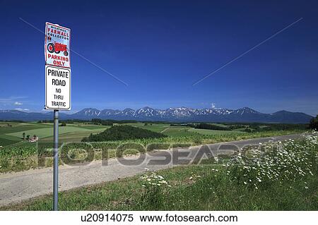 Stock Photography - Road sign and Mt. Tokachi, Hokkaido Prefecture, Japan . Fotosearch