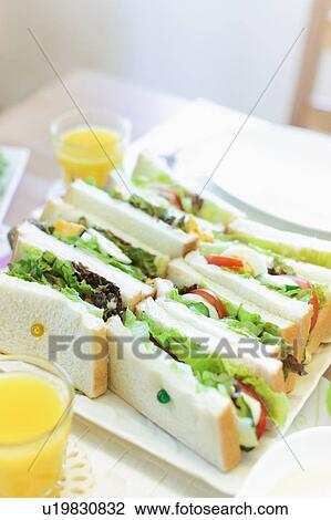 Stock Image - Sandwiches and Orange Juice. Fotosearch