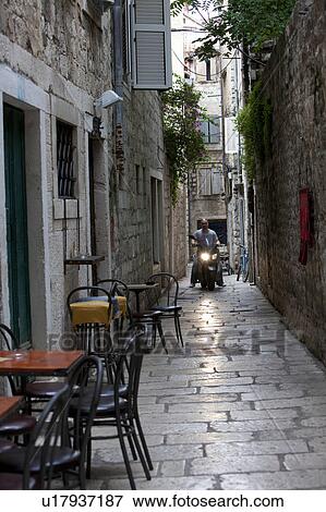Stock Photo - Scooter in Alley. Fotosearch