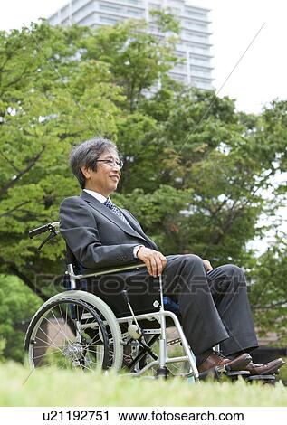 Stock Image - Senior man on wheelchair. Fotosearch