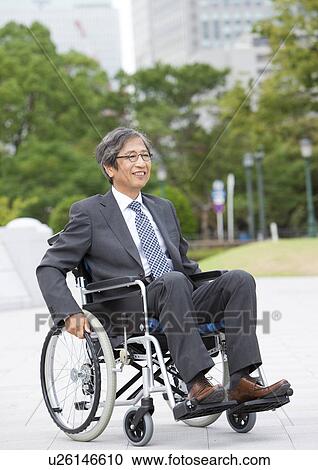 Stock Image - Senior man on wheelchair. Fotosearch