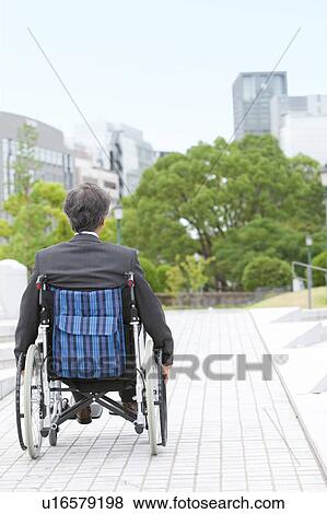 Stock Photo - Senior man on wheelchair. Fotosearch